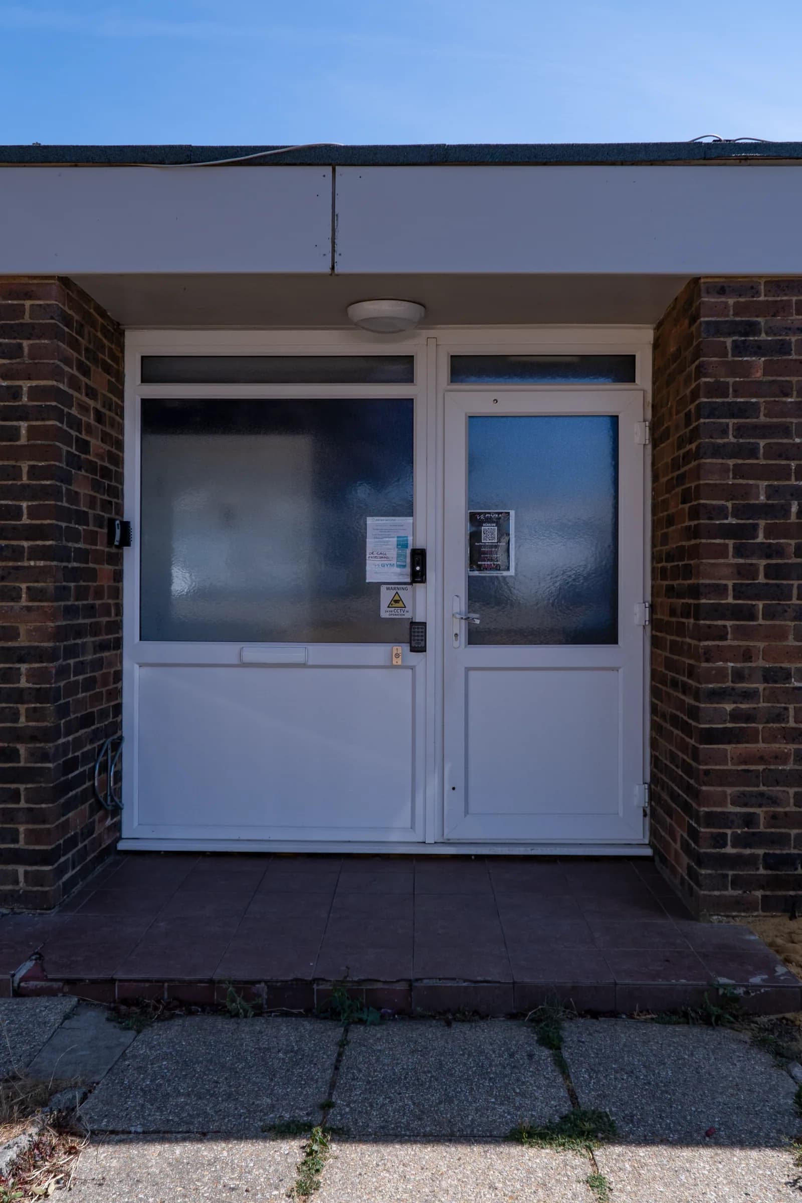 The external entrance doors and access keypad at VK Gym.